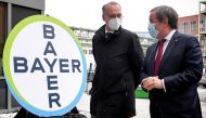Prime Minister of North Rhine-Westphalia Armin Laschet and Werner Baumann, CEO of German pharmaceutical company Bayer AG, speak to the media following their visit to the future production site of CureVac's COVID-19 vaccine (CVnCoV) at the Bayer AG plant i