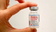 A healthcare worker holds a vial of the Moderna COVID-19 vaccine at a pop-up vaccination site operated by SOMOS Community Care during the coronavirus disease (COVID-19) pandemic in Manhattan in New York City, New York, U.S., January 29, 2021. REUTERS/Mike
