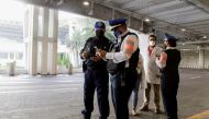 Agents of the city's prosecutors office and police officers collect information outside the airport after an attempted robbery turned into a shootout close to Mexico City's international airport on Friday morning, in which an alleged attacker was killed a