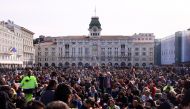People demonstrate at the Unity of Italy Square (Piazza Unita d'Italia), as Italian riot police try to disperse the protest which has taken place for several days against the implementation of the coronavirus disease (COVID-19) health pass, the Green Pass