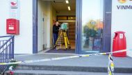 A police officer investigates at the Extra grocery store, where a man killed five people in the city on Wednesday night, in Kongsberg, Norway October 15, 2021. Terje Bendiksby/NTB/via REUTERS
