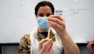 A healthcare worker prepares a dose of the coronavirus disease (COVID-19) vaccine at a vaccination centre inside the Blackburn Cathedral, in Blackburn, Britain, January 19, 2021. REUTERS/Molly Darlington