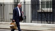 Britain's Housing Secretary Michael Gove walks outside Downing Street, following the death of British MP David Amess who was stabbed to death during a meeting with constituents, in London, Britain, October 18, 2021. REUTERS/Henry Nicholls
