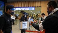 File photo of a tourist scanning a QR code in Malaysia used for representation