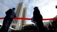 FILE PHOTO: U.S. service members hold the ribbon for a ribbon-cutting at the dedication ceremony for the Walter Reed National Military Medical Center in Bethesda, Maryland, November 10, 2011. REUTERS/Jonathan Ernst/File Photo
