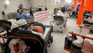 Medical professionals assist coronavirus disease (COVID-19) patients in the overcrowded intensive care unit at the Emergency Hospital 