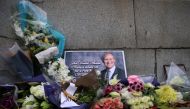 File photo: Floral tributes to British MP David Amess, who was stabbed to death during a meeting with constituents, lay outside the Houses of Parliament, in London, Britain, October 19, 2021. Reuters/Hannah McKay/File Photo