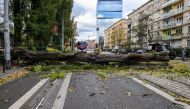 Firefighters remove a fallen tree after very strong winds in Wroclaw, Poland October 21, 2021. Tomasz Pietrzyk/Agencja Gazeta via REUTERS