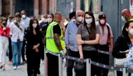 People queue to receive a vaccine against the coronavirus disease (Covid-19) in Berlin, Germany, August 9, 2021. John Macdougall/Pool via Reuters/File Photo