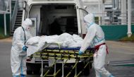 Medical specialists transport a patient outside a hospital for people infected with the coronavirus disease (COVID-19) in Moscow, Russia October 13, 2021. REUTERS/Tatyana Makeyeva/File Photo