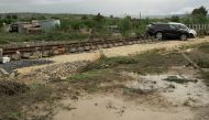 Damaged cars and debris are seen after heavy rain caused flooding in Scordia, near Catania, Italy, October 25, 2021. REUTERS/Antonio Parrinello
