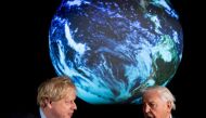 British Prime Minister Boris Johnson and David Attenborough speak with school children during a conference about the COP26 UN Climate Summit, at the Science Museum in London, Britain February 4, 2020. Chris J Ratcliffe/Pool via REUTERS/File Photo