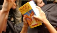 A child holds a copy of 