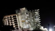 FILE PHOTO: The partially collapsed Champlain Towers South residential building is demolished, in Surfside, Florida, July 4, 2021. REUTERS/Marco Bello/File Photo