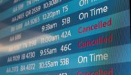 A screen showing cancelled flights is seen at Los Angeles International Airport as more than 1,400 American Airlines flights over the weekend have been canceled due to staff shortages and unfavorable weather in Los Angeles, California, U.S., October 31, 2021. REUTERS/Carlos Barria
