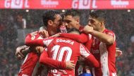 Atletico Madrid players celebrates their second goal, an pwn goal scored by Real Betis' German Pezzella REUTERS/Juan Medina
