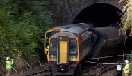 Emergency services personnel inspect the site where two trains collided near Salisbury, Britain, November 1, 2021. REUTERS/Tom Nicholson