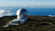 The world's largest GTC telescope is photographed from Roque De Los Muchachos. The eruption of Spain?s Cumbre Vieja volcano is disrupting activity at the Roque de Los Muchachos observatory. On the Canary Island of La Palma, Spain. October 28, 2021. REUTERS/Borja Suarez