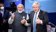 Britain's Prime Minister Boris Johnson and India's Prime Minister Narendra Modi attend the 
