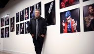 Renowned British photographer Rankin poses for a portrait alongside photographs he has taken for his 'Performance by Rankin' series, in London, Britain, November 3, 2021. REUTERS/Henry Nicholls
