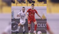 Al Sadd's Guilherme Torres (left) and Al Duhail's Rabeh Yahia Boussafi in action.