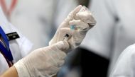 File photo: A healthcare worker fills a syringe with a dose of Bharat Biotech's COVID-19 vaccine called COVAXIN, during the coronavirus disease (COVID-19) vaccination campaign, January 16, 2021. Reuters/Adnan Abidi/File Photo