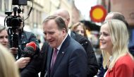 Swedish Prime Minister Stefan Lofven interacts with journalists as he walks from the government headquarters to the Swedish Parliament Riksdagen to hand in his resignation to the speaker of parliament in Stockholm, Sweden November 10, 2021. Duygu Getrien/TT News Agency