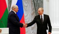 Russian President Vladimir Putin and his Belarusian counterpart Alexander Lukashenko shake hands during a news conference following their talks at the Kremlin in Moscow, Russia September 9, 2021. REUTERS/Shamil Zhumatov/File Photo
