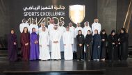 Minister of Youth and Sport H E Salah bin Ghanem Al Ali, Qatar Olympic Committee (QOC) President H E Sheikh Joaan bin Hamad Al Thani and QOC Secretary-General Jassim Rashid Al Buenain pose for a photograph with award winning Qatari athletes during the Sport Excellence Awards 2021 at Barahat Msheireb yesterday.
