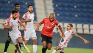 Al Rayyan's Yacine Brahimi vies for the ball possession with Al Shamal players during yesterday's match.