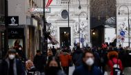 Pedestrians walk along a shopping street after the Austrian government placed roughly two million people who are not fully vaccinated against the coronavirus disease (COVID-19) on lockdown, in Vienna, Austria, November 17, 2021. REUTERS/Leonhard Foeger
