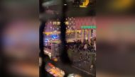 Police vehicles are seen near protesters during demonstrations against coronavirus disease (COVID-19) measures which turned violent in Rotterdam, Netherlands, November 19, 2021, in this still image obtained from video provided on social media. 
