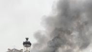 Fire and smoke come out of a building near Place de l'Opera in Paris, France, November 20, 2021 in this still image obtained from a social media video. @alex_grandremy/via REUTERS 