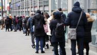 People queue up outside a vaccination centre in a shopping mall, amid the COVID-19 pandemic, in Berlin, Germany, November 20, 2021. REUTERS/Christian Mang
