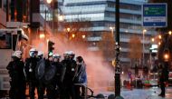 Police forces stand guard as people protest against coronavirus disease (COVID-19) measures near the European Commission in Brussels, Belgium November 21, 2021. REUTERS/Johanna Geron
