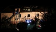 Firefighters enter a nursing home where nine people were killed in a fire in the village of Royak, Bulgaria, November 22, 2021. Lyubomir Benkovski/Bulphoto Agency/via REUTERS
