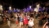 FILE PHOTO: People gather in the streets of Barcelona in the evening of May 17, 2021. REUTERS/Albert Gea/File Photo
