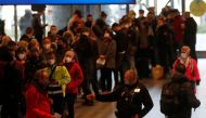 People wait in a line to get the coronavirus disease (COVID-19) vaccine at Prague's main railway station, Czech Republic, November 22, 2021. REUTERS/David W Cerny
