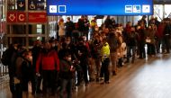 People wait in a line to get the coronavirus disease (COVID-19) vaccine at Prague's main railway station, Czech Republic, November 22, 2021. REUTERS/David W Cerny/File Photo