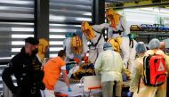 Medical staff members transport a coronavirus disease (COVID-19) patient, who is being transferred from a Brno hospital, in Prague, Czech Republic, November 25, 2021. REUTERS/David W Cerny
