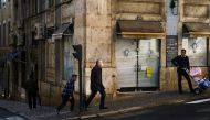 A man wearing a protective mask due to coronavirus disease (COVID-19) pandemic walks in central Lisbon, Portugal, November 25, 2021. REUTERS/Pedro Nunes

