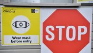 Signage to wear a face mask is seen outside a vaccination centre, as the spread of the coronavirus disease (COVID-19) continues in Dublin, Ireland, November 30, 2021. REUTERS/Clodagh Kilcoyne
