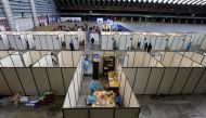 Medical workers prepare doses of the 