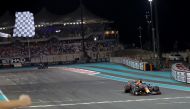 Red Bull's Max Verstappen crosses the line to win the race and the world championship Pool via REUTERS/Kamran Jebreili
