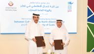 Chairman of General Authority of Customs (GAC), Ahmed bin Abdullah Al Jamal, and President of CNA-Q, Dr. Salem bin Nasser Al Naemi exchanging documents after singing the MoU.