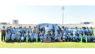 Qatar Cricket Association officials with coaches and participants of the Criiio Entry Level Programme Criiio Entry Level Programme at Asian Town Cricket Stadium.