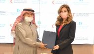 Chairperson of the Board of Trustees of KHCC, HRH Princess Ghida Talal and QRCS Secretary-General Ali bin Hassan Al Hammadi after signing the agreement.