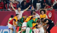 Soccer Football - Arab Cup - Semi-Final - Tunisia v Egypt - 974 Stadium, Doha, Qatar - December 15, 2021 Tunisia players celebrate after the match REUTERS.