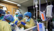 FILE PHOTO: A respiratory therapist and six nurses prone a coronavirus disease (COVID-19) patient inside the intensive care unit of Humber River Hospital in Toronto, Ontario, Canada April 19, 2021. REUTERS/Carlos Osorio/File Photo
