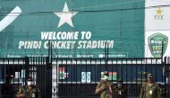 FILE PHOTO: Police officers stand guard outside Rawalpindi Cricket Stadium after New Zealand cricket team pull out of a Pakistan cricket tour over security concerns, in Rawalpindi, Pakistan September 17, 2021. REUTERS/Waseem Khan

